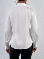 Stylish shirt with ruffled and layered design details.