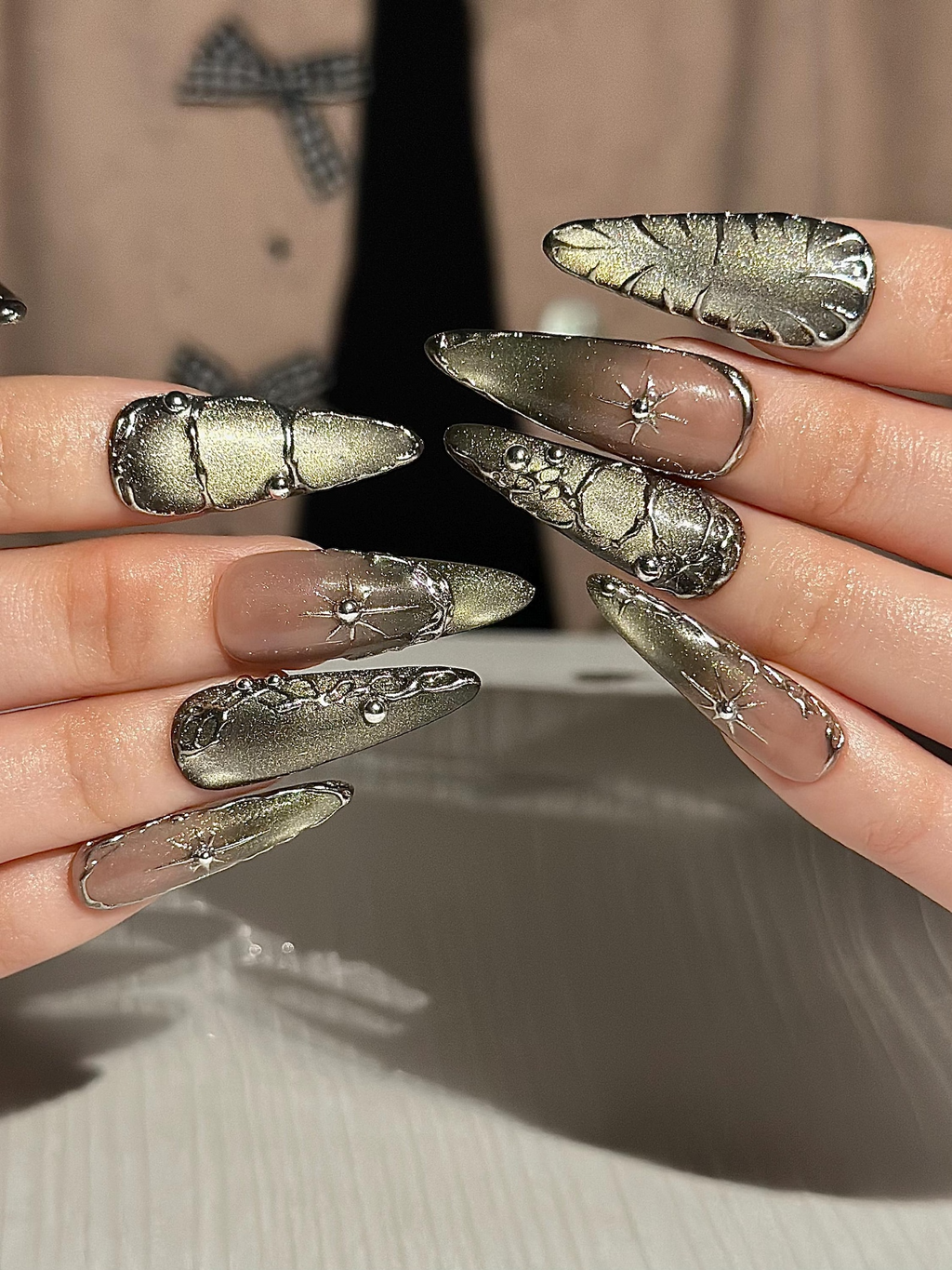 Gothic Celestial Press On Nails. Dark Cat Eye Galaxy Nails with Silver Stars. Edgy Ethereal Stiletto Nails with Metallic Charms. OC1289HC