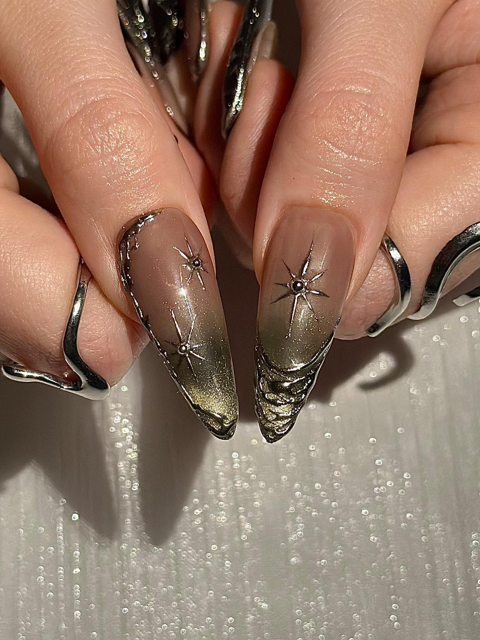 Gothic Celestial Press On Nails. Dark Cat Eye Galaxy Nails with Silver Stars. Edgy Ethereal Stiletto Nails with Metallic Charms. OC1289HC